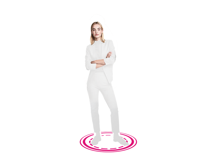 A woman dressed in white standing on a magenta circle with her arms folded