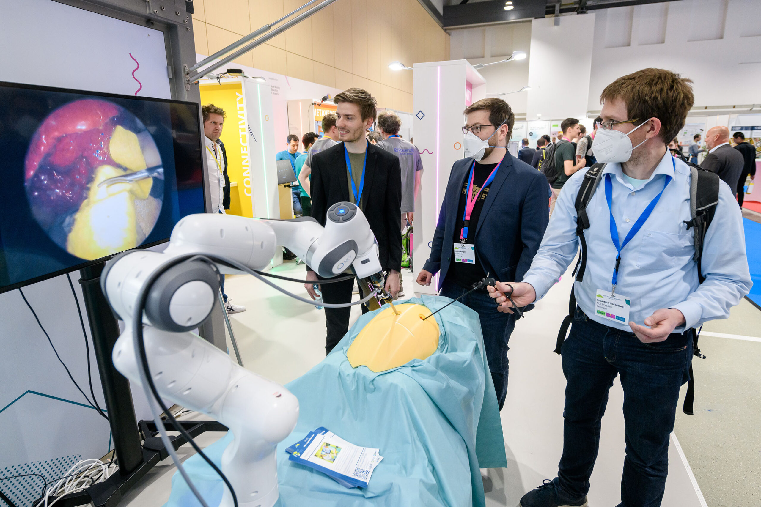 Photograph from the IEEE 5G Summit where the use of robotic assistance in medicine is presented