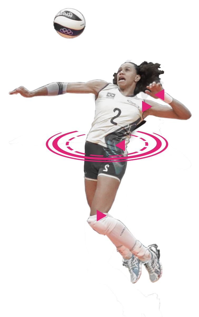 A volleyball player doing an attacking shot with a pink circle around her belly