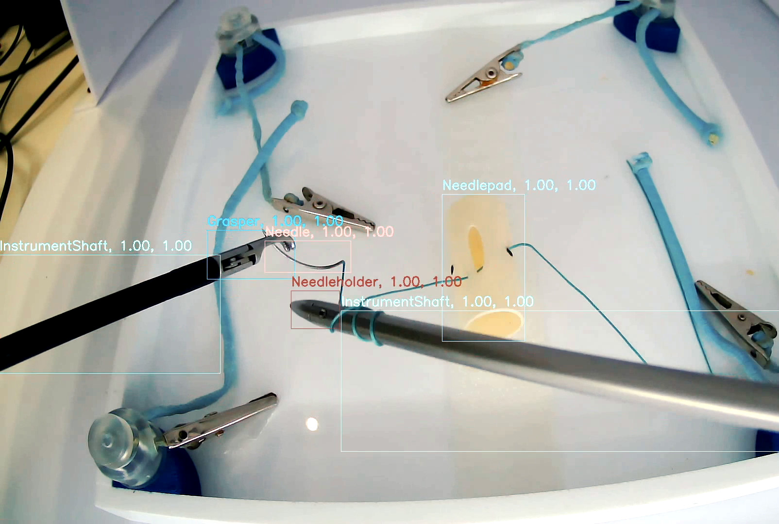 Medical instruments being used in training with an AR overlay